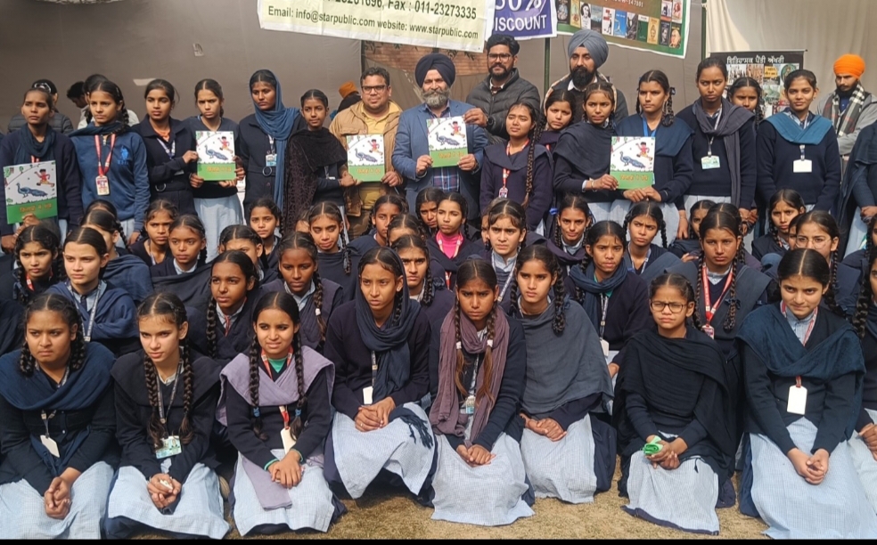 Dr. Asht's children's book 'Kitabon Mein Pankh' released by children at the book fair